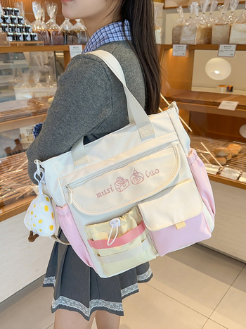 Japán stílusú, friss és aranyos válltáska, Oxford anyagból, vízszintes négyszögletes forma, cipzáras zárás, belső cipzáros zseb és laptopzseb