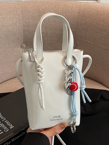 PU ämberlaadse koti lukuga, sisetaskud telefoni ja ID-kaardile, voodrita