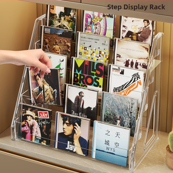 CD ekspozicijos stovas su pakopomis lentynomis, medžiaga PET+PS, šiuolaikinis minimalistinis stilius, prekės ženklas Evesigar/isi home, modelis 2300026402766717697, daugiafunkcinis