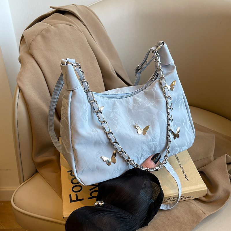 Õla- ja kaenla kott loki motiiviga - PU nahk, suur maht, tõmblukk, sisetaskud telefonile ja ID-le