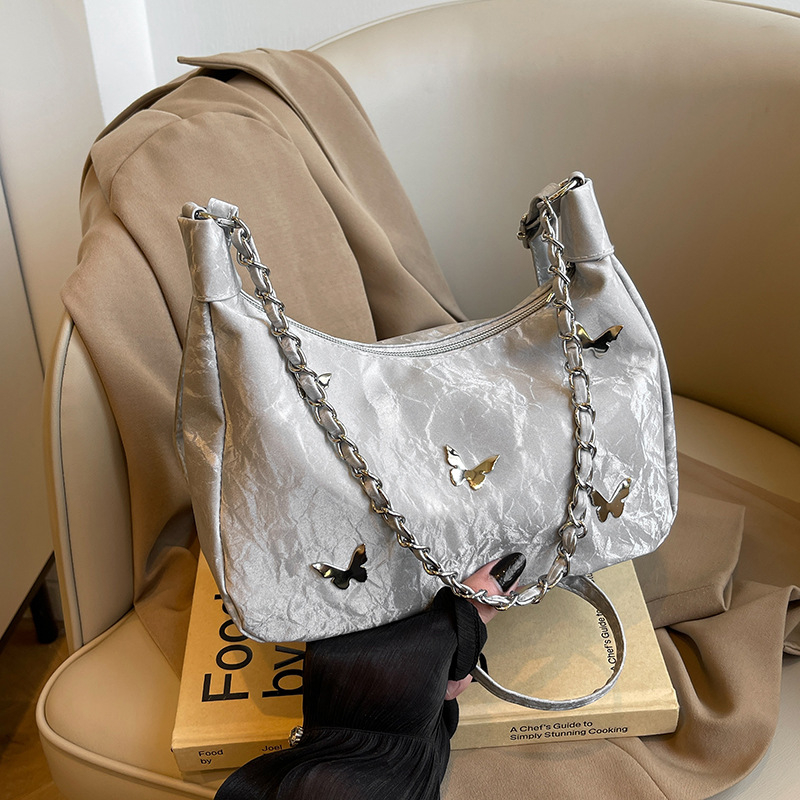 Õla- ja kaenla kott loki motiiviga - PU nahk, suur maht, tõmblukk, sisetaskud telefonile ja ID-le