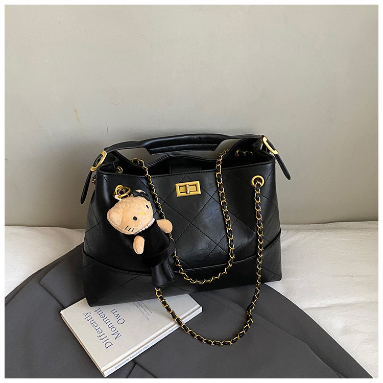 Geantă crossbody bucket din velur cu aspect căptușit (formă orizontal pătrată; închidere cu lacăt; interior laminat cu fermoar; curea simplă)