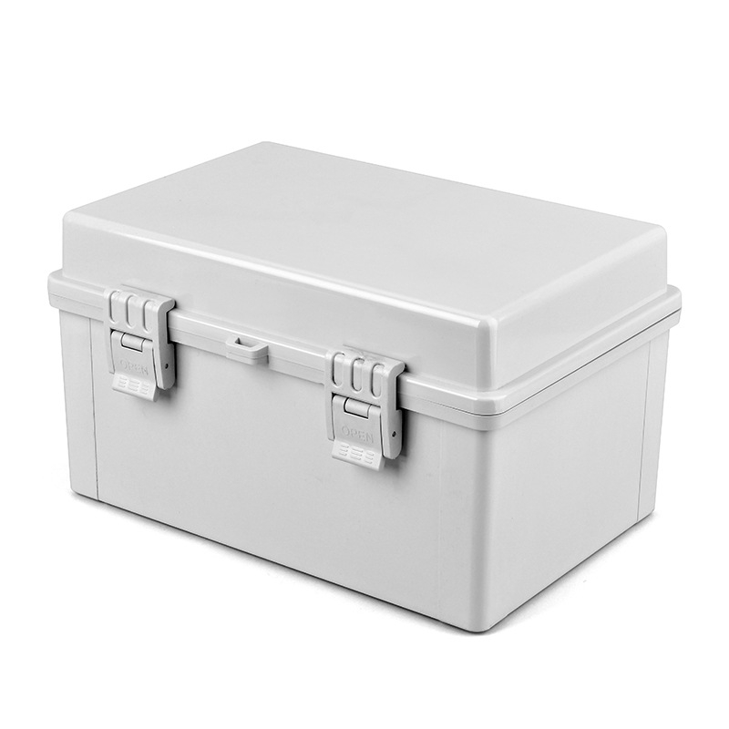 IP65 plastmasas ūdensizturīga sadales kārba ārējai lietošanai, korpuss ABS/PC, sienas montāža ar šarnīru aizslēgu, caurspīdīgs vāciņš