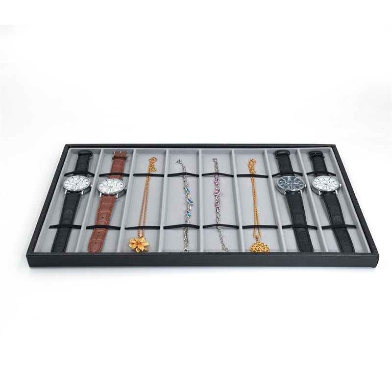 Pulksteņu displeja statīvs ar 10 nodalījumiem – pulksteņu uzglabāšana; materiāli: MDF, blister, PU āda, flanelis; tolerances 3–5 mm; juvelierizstrādājumu iepakojums