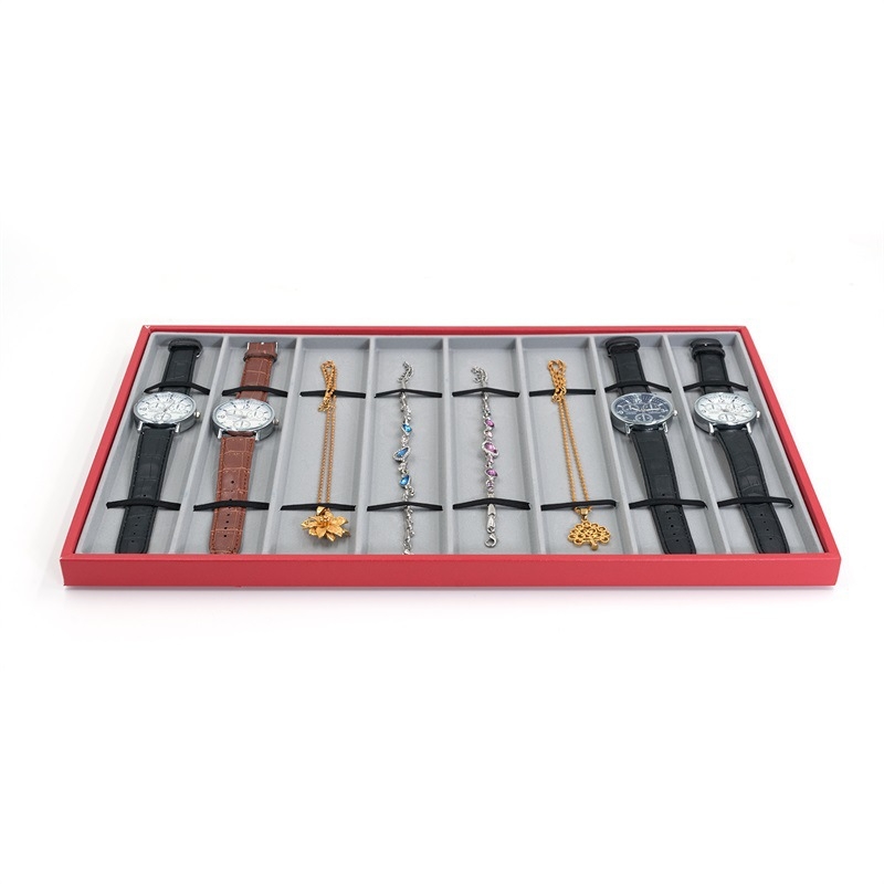 Pulksteņu displeja statīvs ar 10 nodalījumiem – pulksteņu uzglabāšana; materiāli: MDF, blister, PU āda, flanelis; tolerances 3–5 mm; juvelierizstrādājumu iepakojums