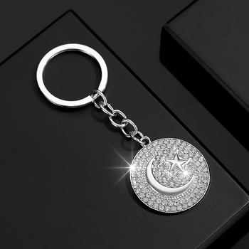 Stilingas ir žavingas unisex raktų pakabukas saulės, žvaigždės, mėnulio ir religinių simbolių formos, visiškai inkrustuotas kristalais.