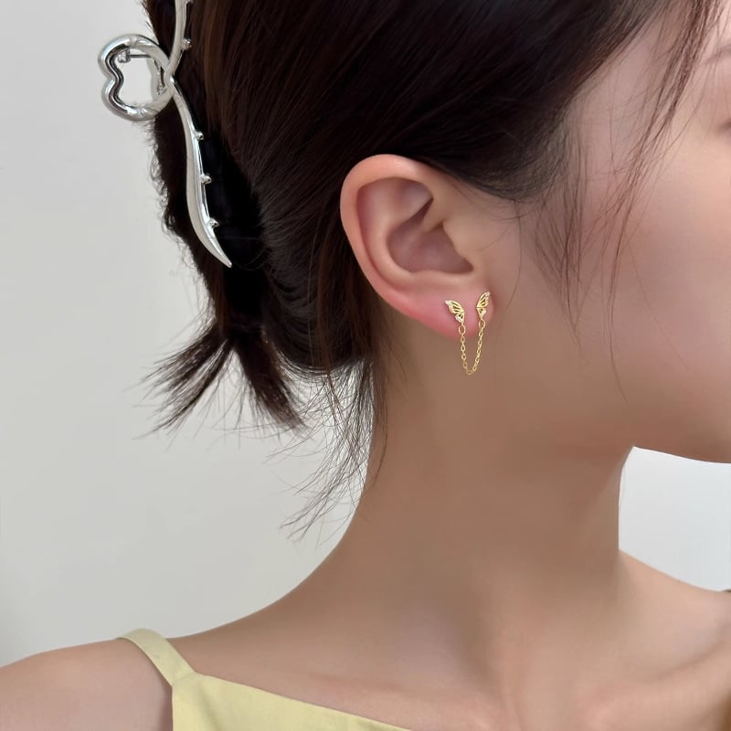 Auskari no 925 sudraba ar tauriņa motīvu un kulšu akcentiem, nišas modes stils sievietēm