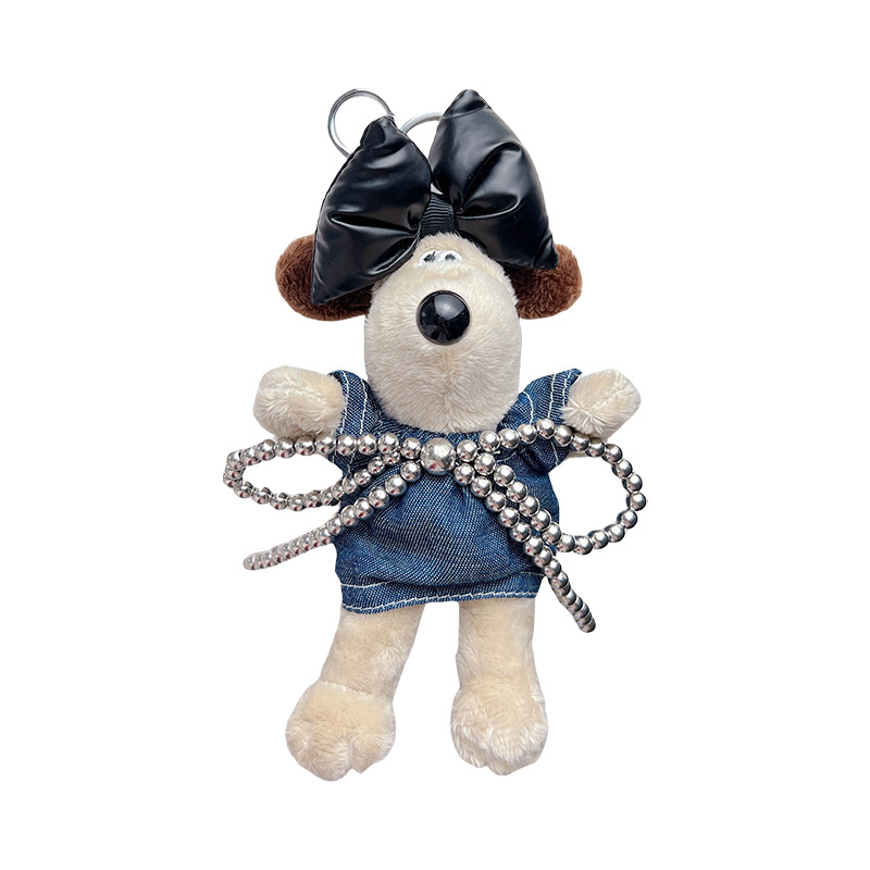 Pliša atslēgu piekariņš ar karikatūras kucēnu, denim svārkiem un lielu loku