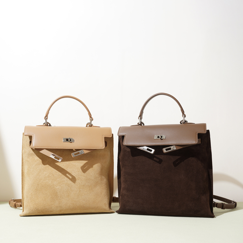 Naistele mõeldud ehtne nahast kott mattviimistlusega, vertikaalse ruudu kujuga, üks õlarihm, lukuga avamine, sisemine lukuga tasku