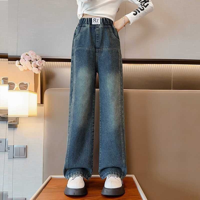 Mergaitėms platėji džinsai su elastine juosta, medvilnės mišinys 38,8%, švelni tekstūra, pavasario–rudens 2025