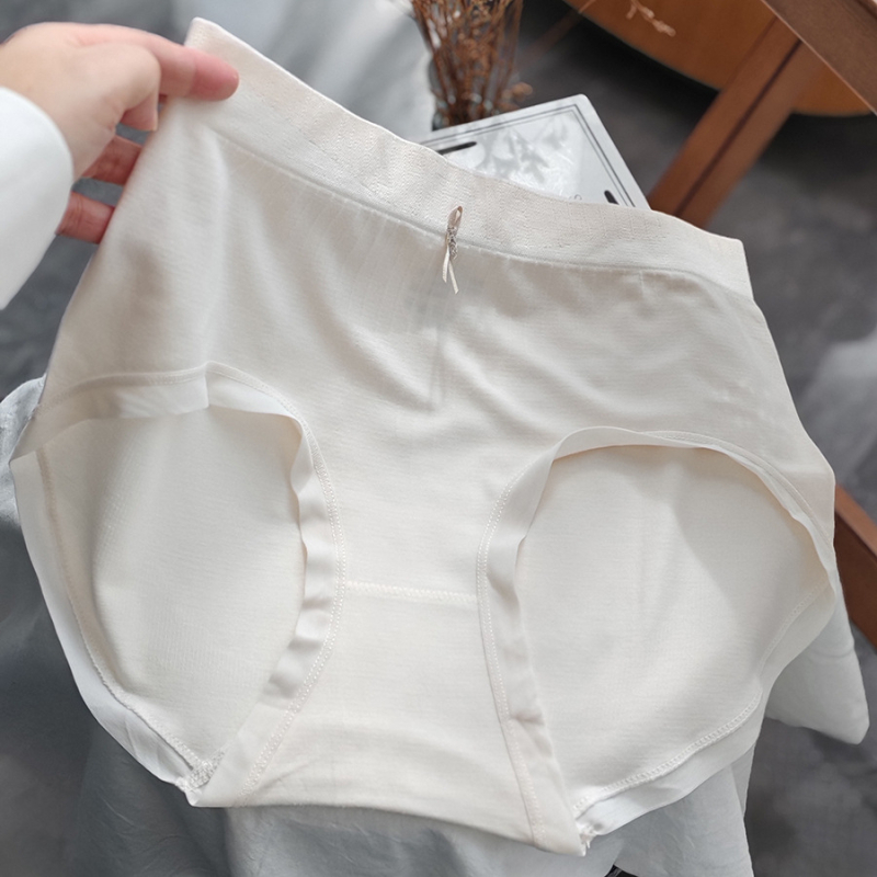 Naiste keskjoones püksid, ilma küljeõmblusteta, hingav regenereeritud tselluloosi kiududest kangas; kroö