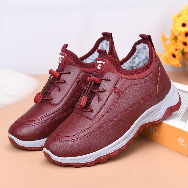 Talvekingad naistele: kunstliku naha ülemisega ja kunstliku lühikese plüüsvoodriga, soojad, madala profiiliga, ees nööriga kinnitatav ning plastist tald