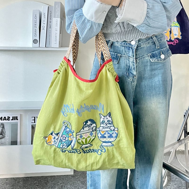 Női nylon táska Shiba Inu hímzéssel, ovális alak, szalag zárás, belső patch zseb