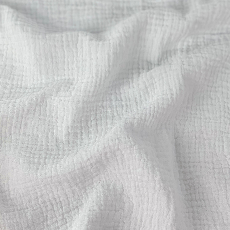 Kétrétegű pamut géz anyag buborékos textúrával és krepp felülettel, 100% pamut, babáknak.