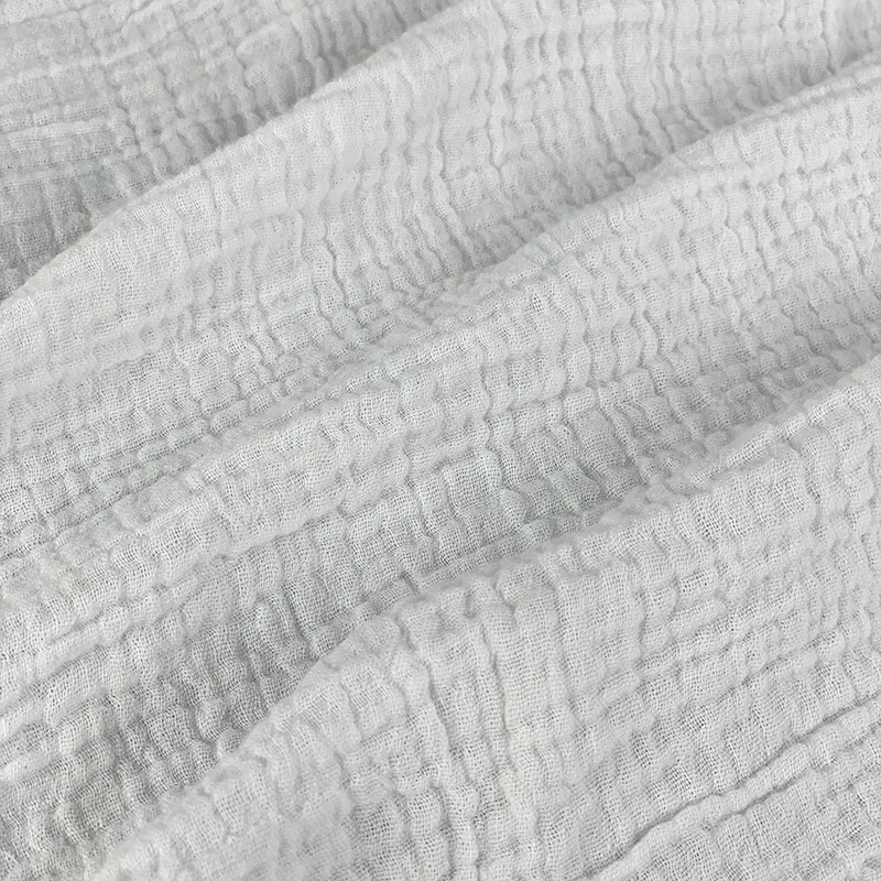 Kétrétegű pamut géz anyag buborékos textúrával és krepp felülettel, 100% pamut, babáknak.