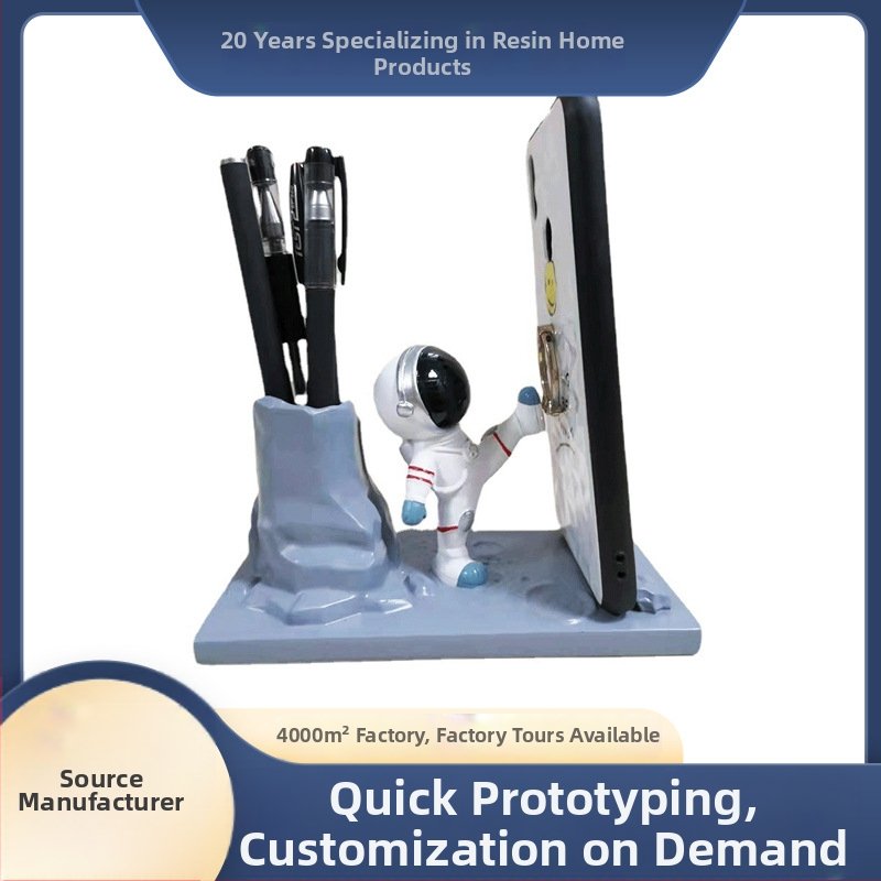 Astronaudi telefonihoidja ja pliiatsihoidik – ümmargune lauaorganisaator sünteetilisest vaigust