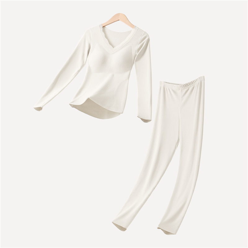 Moterų terminių apatinių komplektas su įdėta krūtinės pagalvėle, stora poliesterio medžiaga, V formos iškirptė, ilgomis rankovėmis viršutinė dalis ir kelnaitės (polieasterio audinys; įdėta krūtinės pagalvėlė; V- iškirptė; stora medžiaga)