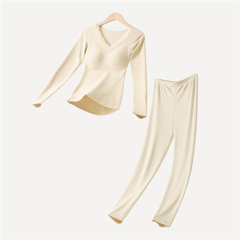 Moterų terminių apatinių komplektas su įdėta krūtinės pagalvėle, stora poliesterio medžiaga, V formos iškirptė, ilgomis rankovėmis viršutinė dalis ir kelnaitės (polieasterio audinys; įdėta krūtinės pagalvėlė; V- iškirptė; stora medžiaga)