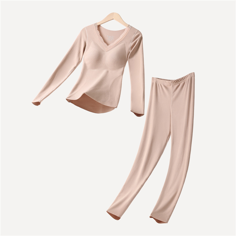 Moterų terminių apatinių komplektas su įdėta krūtinės pagalvėle, stora poliesterio medžiaga, V formos iškirptė, ilgomis rankovėmis viršutinė dalis ir kelnaitės (polieasterio audinys; įdėta krūtinės pagalvėlė; V- iškirptė; stora medžiaga)