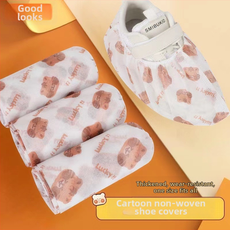 Vienkartiniai nepluošto avalynės uždangalai, su karikatūrų spauda, pakuotėje 50 vnt