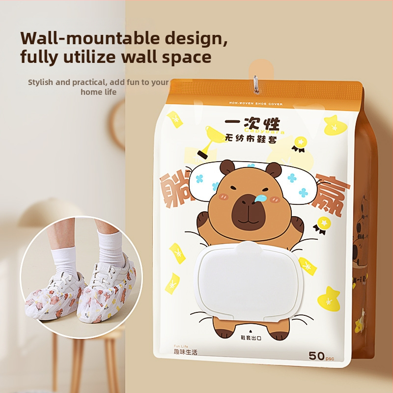 Vienkartiniai avalynės užklotai iš neaudinio medžiagos su kapibara raštu, elastinis žiedas ir tempimo raištis, namų naudojimui, įprastas storis