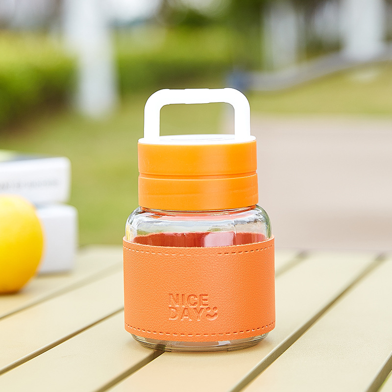 Prijenosna staklena čaša s poklopcem – nepropusna, otporna na visoke temperature, kompaktni kružni dizajn