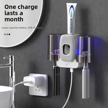 Ant sienos tvirtinamas dantų šepetėlių laikiklis su UV sterilizacija, dantų pastos išspaudiklis ir dvigubas puodelių laikymo skyrius, iš plastiko