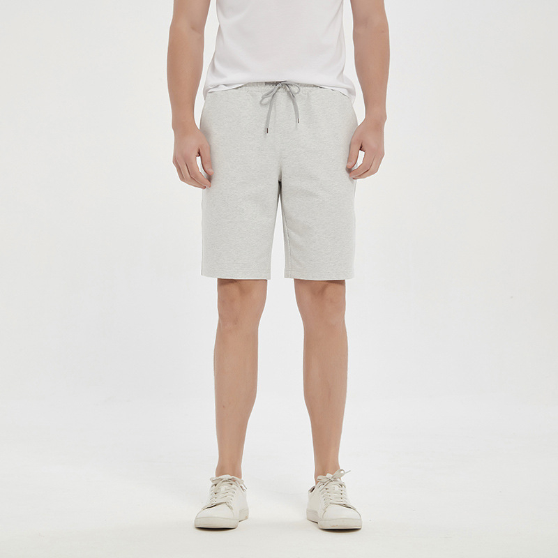 Vīriešu kokvilnas maisījuma sporta šorti, viduklis vidējā līmenī, brīvs plašs piegriezums, aizdare ar šņori