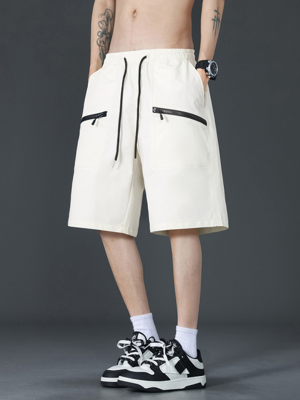 Ikdienas cargo šorti – brīvs griezums, vidēja josta, poliestera audums ar trīsdaļīgu režģi, daudz kabatu