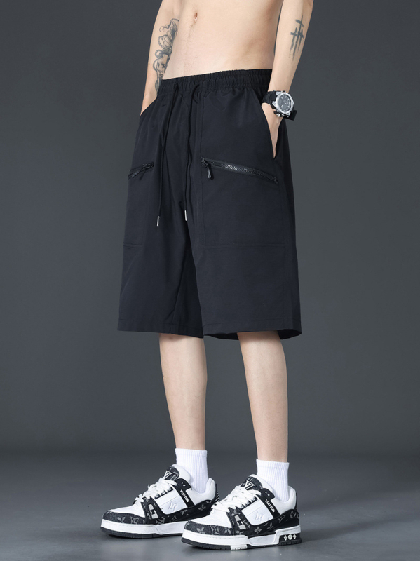 Ikdienas cargo šorti – brīvs griezums, vidēja josta, poliestera audums ar trīsdaļīgu režģi, daudz kabatu