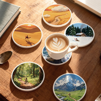 Diatomitų padėkliukai stiklinėms su peizažų motyvu, apvalūs, sugeria vandenį, greitai džiūsta, neslidūs, su individualiu logotipu