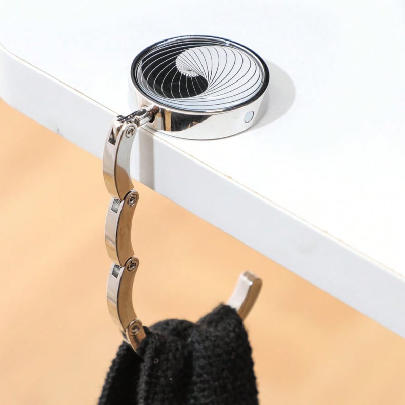 Portatyvinė sulankstoma maišų kabykla prie stalo krašto — cinko lydinys, vienas kabliukas, šiuolaikinis minimalistinis dizainas, prekės kodas Zh-036, 1 vnt