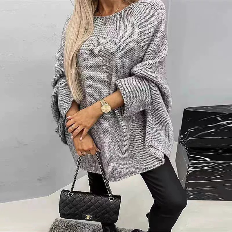 Pleten džemper s cape pončo siluetom, rukavi v tipu bat, okrugli izrez, dugački kroj 80–100 cm, akrilno vlakno