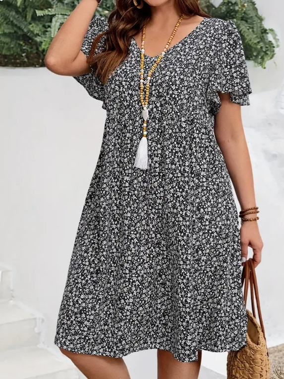 V kaklo iškirptė, išskleistas gėlių raštas su suplyšusiu motyvu, trumpomis volanomis rankovėmis, skėtis tipo suknelė, poliesteris su spandeksu