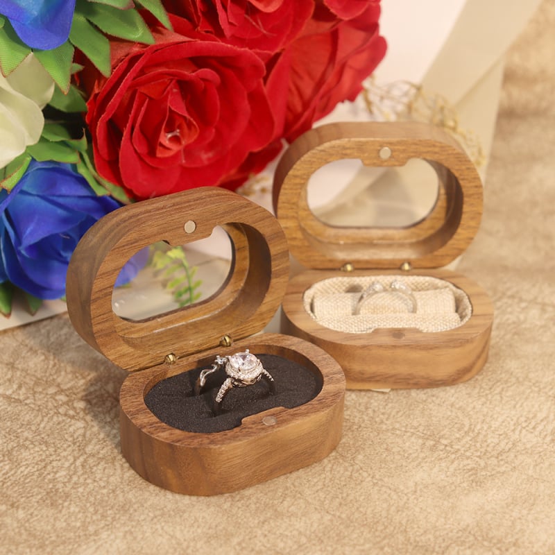 Valriekstu koka juvelierizstrādājumu glabāšanas kaste ar ovālu akrila logu, piemērota gredzeniem un auskarām