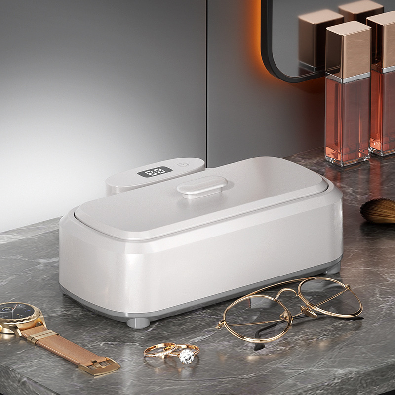 Ultragarsinis valymo įrenginys akinėms, juvelyrikai, breketėms ir kontaktiniams lęšiams, sterilizavimas, didelė talpa; Modelis 975; Darbinis režimas: mechaninis; Laiko funkcija: <2 val.; Maitinimas: kintamoji srovė, 100–240 V