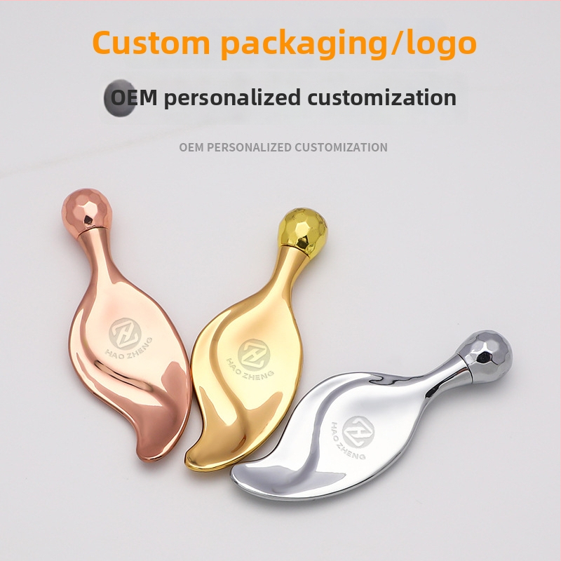 Lapaiem līdzīgs kosmētikas masāžas instruments ar vienu lodīti un metāla rullīti, cinka sakausējums, manuāla darbība