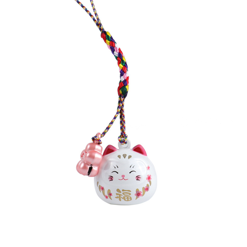 Metalo varpelio pakabukas su laimingos katės ir vyšnios žiedų motyvais