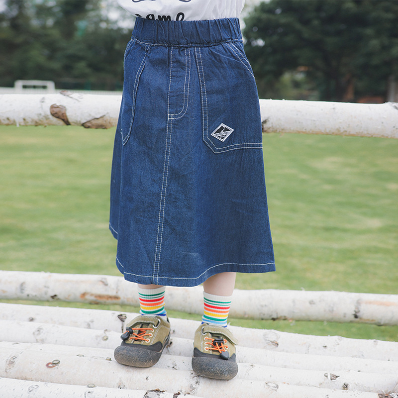 Mergaitėms džinsinė sijonėlis, 99% medvilnė, pamušalas 91–99% medvilnė, raidės raštas, švelnus apdorojimas, 3–8 metų amžius, pavasaris 2025