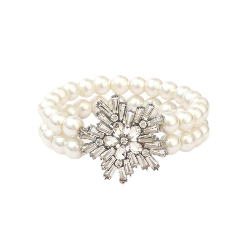 Dirbtinių perlų juvelyrinių komplektas: auskarai, karolė ir apyrankė; snaigių raštas; pakabuko medžiaga: lydinys; apdorojimo technologija: deimantas; medžiaga: dirbtinės perlai