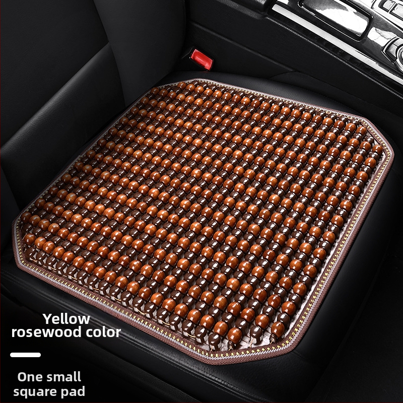 Automobiļa sēdekļa spilvens, viengabala kvadrātiska no koka lodītēm, aizmugures sēdeklim, elpojošs un pretslīdējošs.