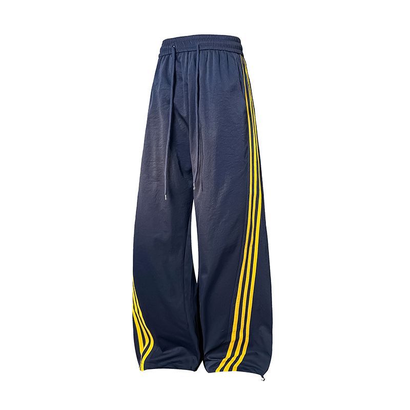 Meeste vabaajarõivaste püksid kontrastsete triipudega, kõrge vöökoht, lai lõige, nööriga kinnituv sulgemine, fleece vooder