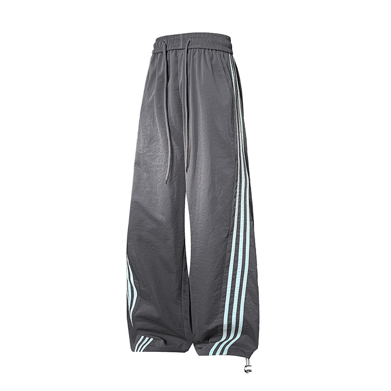 Meeste vabaajarõivaste püksid kontrastsete triipudega, kõrge vöökoht, lai lõige, nööriga kinnituv sulgemine, fleece vooder