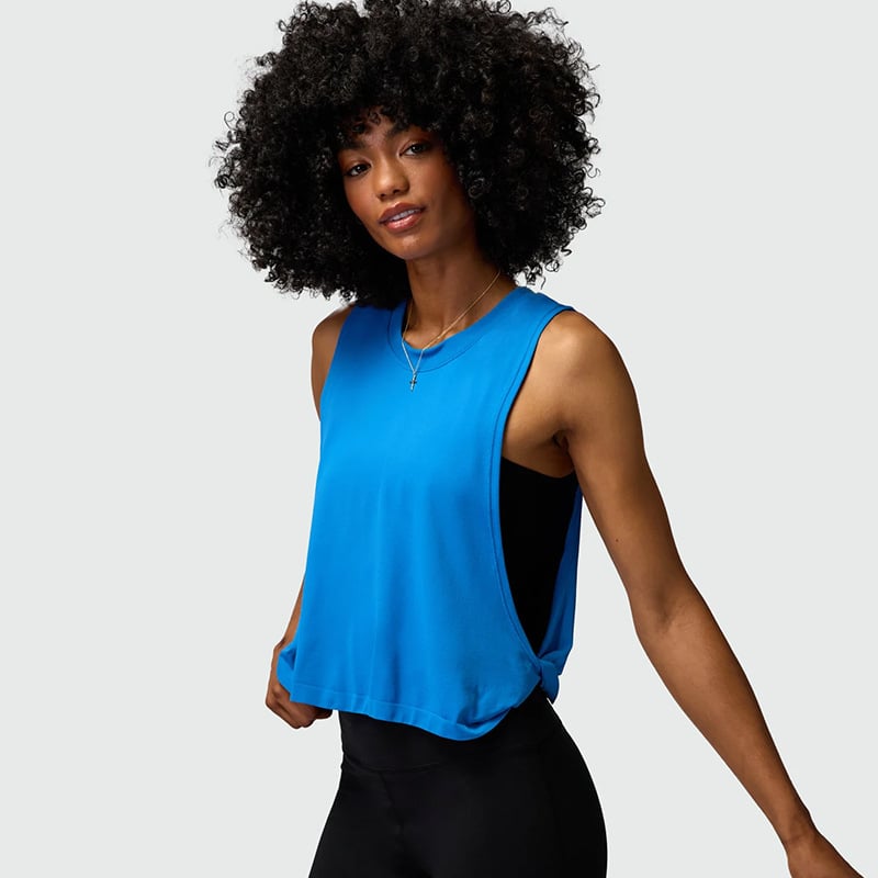 Moteriški laisvi be rankovių sportiniai topai bėgimui ir jogai – drėgmės sugėrimas, kvėpuojantis audinys, sudėtis: 87% nailonas, 13% spandeksas.