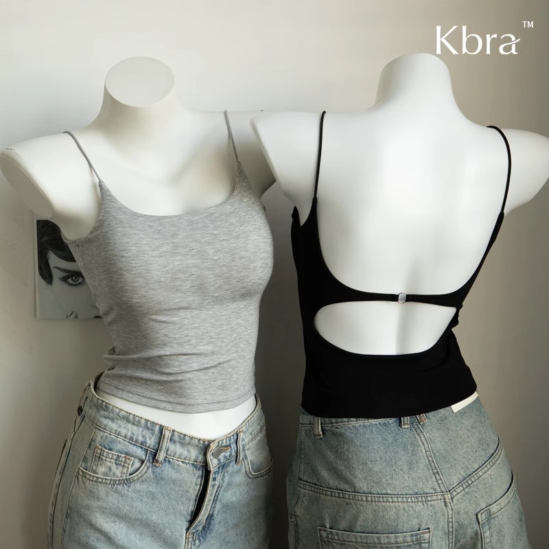 Kamisolė su iškirpte nugaroje ir krūtų pagalvėlėmis, siauras kirpimas, sling dirželiai, apvalus kaklo iškirpimas, viskozė 70–80%, tinkama visiems metų laikams