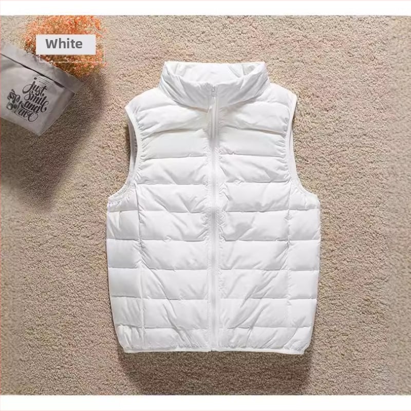 Moteriška plona pūkinė liemenė su stovinčia apykakle ir užtrauktuku, užpildas: pūnas, liesas siluetas, ilgis 50–65 cm.