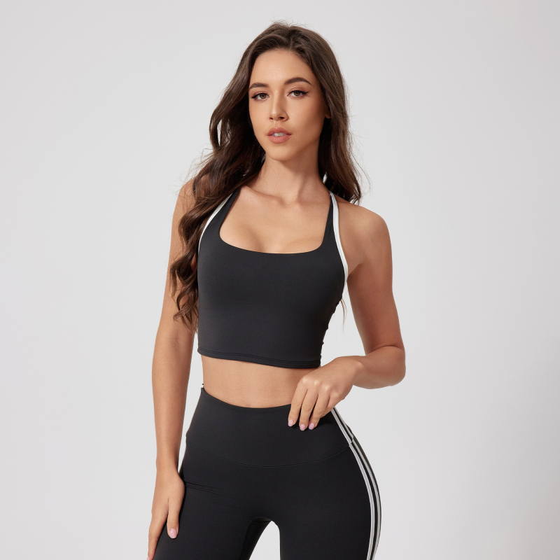 Moterų sportinis biustas bėgimui ir fitnesui su fiksuotomis dvigubomis peties juostelėmis, 3/4 kupra, vidutinio formavimo kupra, pagrindinis audinys nailonas 75%, įdaila nailonas 75%.