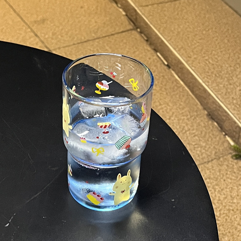 Terminuoto stiklo vandens puodelis su karikatūriniu raštu, apvalus be rankenos, atsparus karščiui, tinkamas arbatai ir kavai, galima pritaikyti