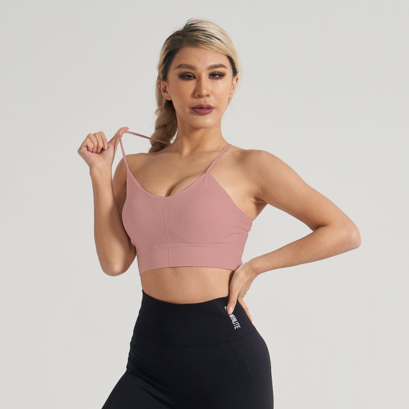 Joga viršelis su natūraliaus jausena, šoninis krūtinės palaikymas, sportinis liemenė su kryžmine nugara ir smūgių sugeriamasis dizainas; Audinys: brokatas spandeksas; Medžiaga: nailonas; Krojus: siauras; Trumpas ilgis; Įtraukti krūties pagalbliai