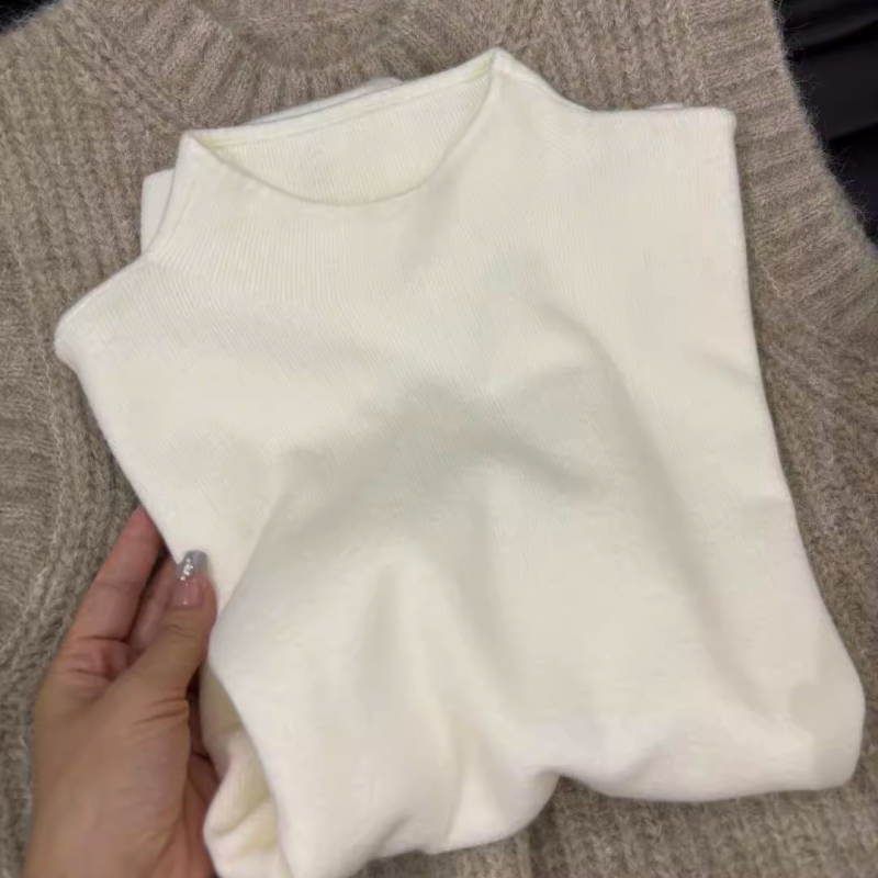 Moterų megzta liemenė, Royal Sister stilius, apvalus kaklas, ilgis 50–65 cm, vienos spalvos, ruduo 2025